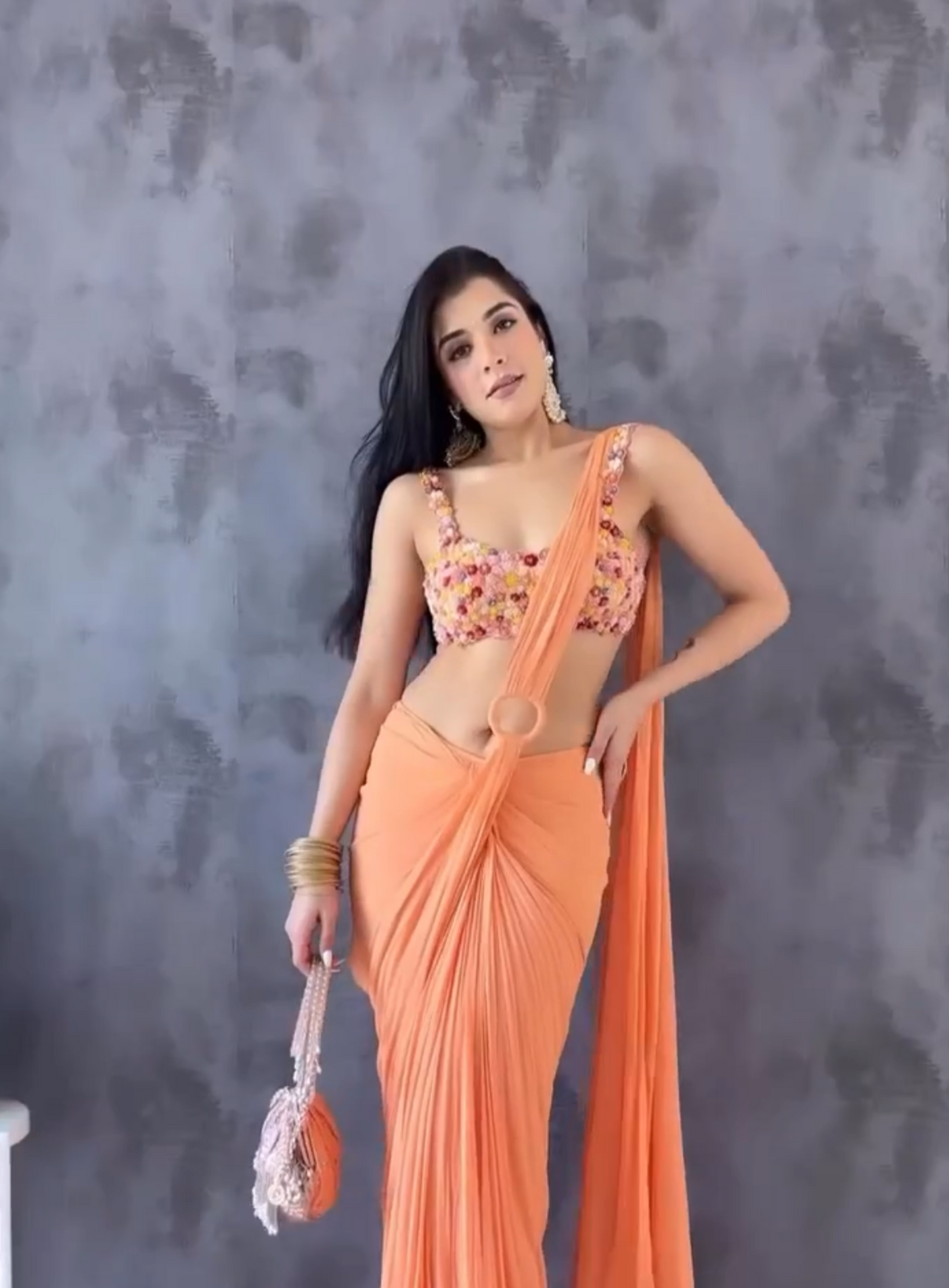 Sukhamni Gambhir in our coral drape saree