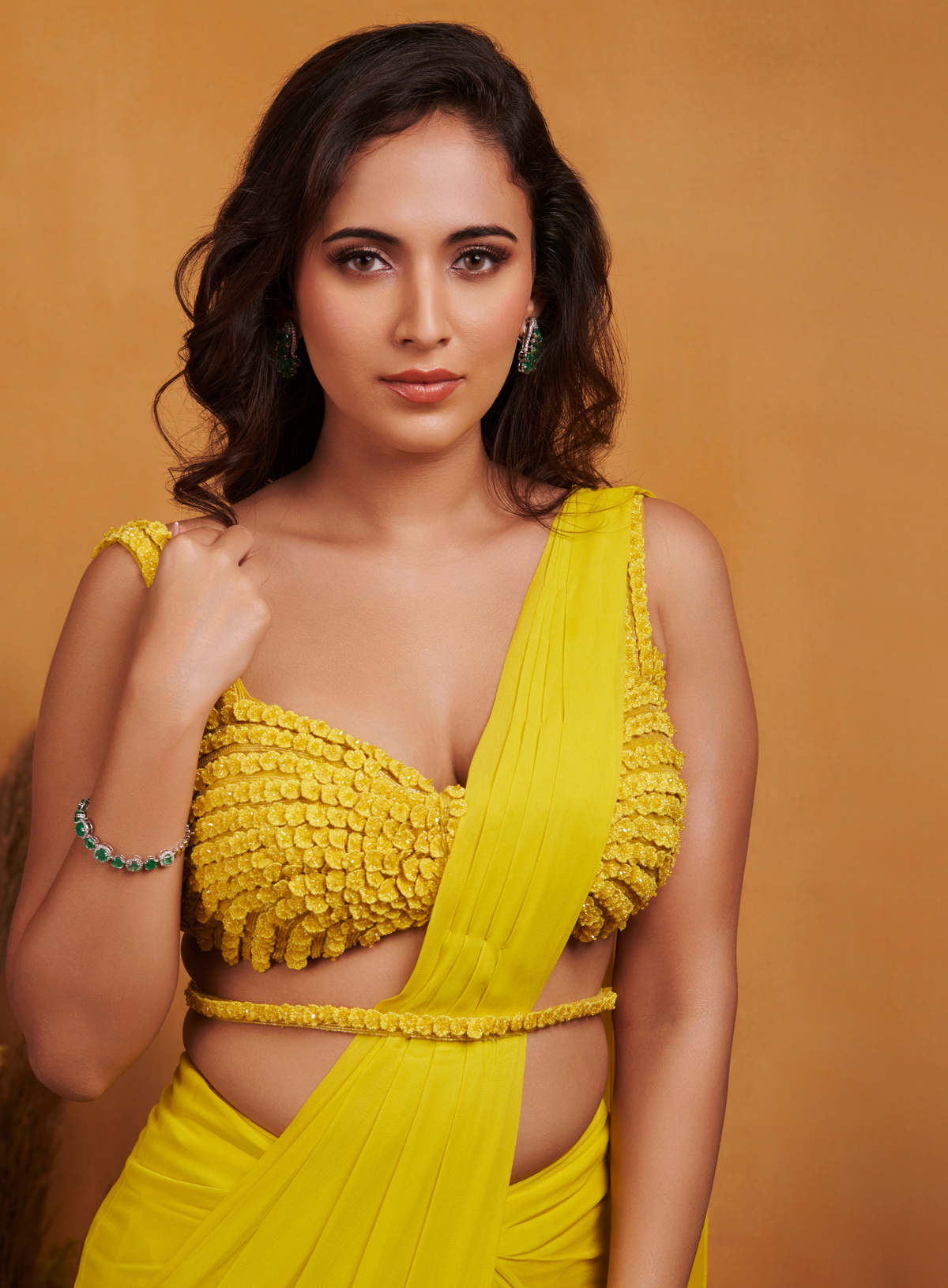 Close-up of the embellished yellow bodice and waist detail from K&A's haldi-ready drape saree