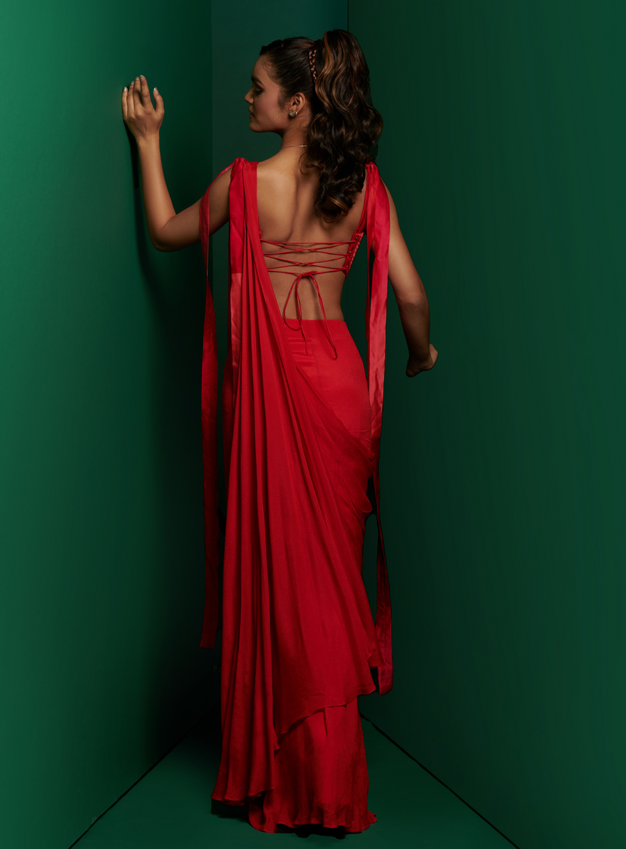 Back view of the crimson red drape saree with criss-cross lace-up open back