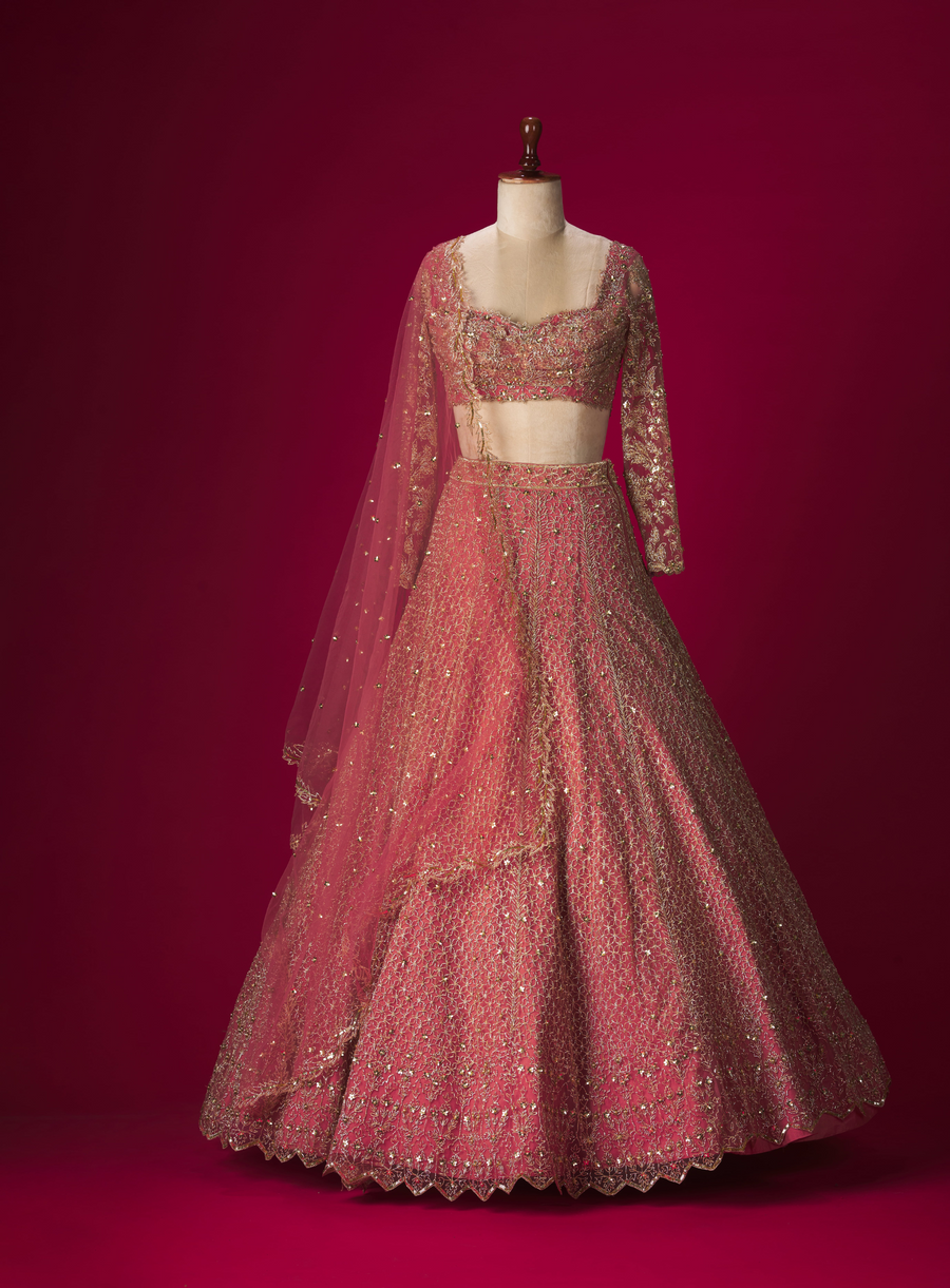 Peach net lehenga set with pita work hand-embroidery
