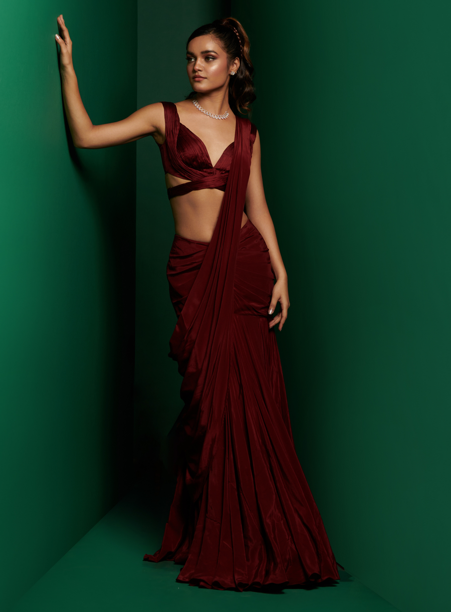 Full-length view of the dark maroon cross body blouse with drape saree
