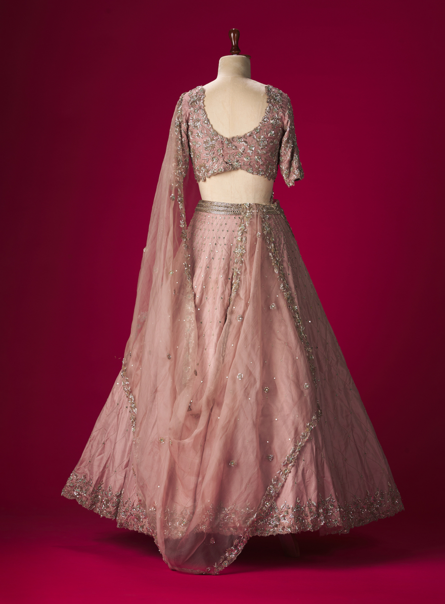 Back view of the mauve mirror-work lehenga and zardozi blouse with dupatta on a mannequin