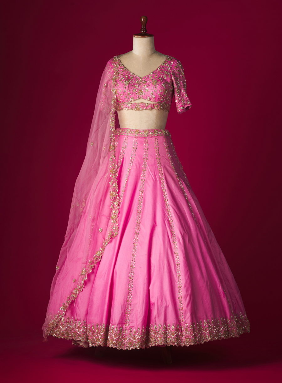 Pink silk lehenga with cut-out embellished blouse in zardozi embroidery and dupatta