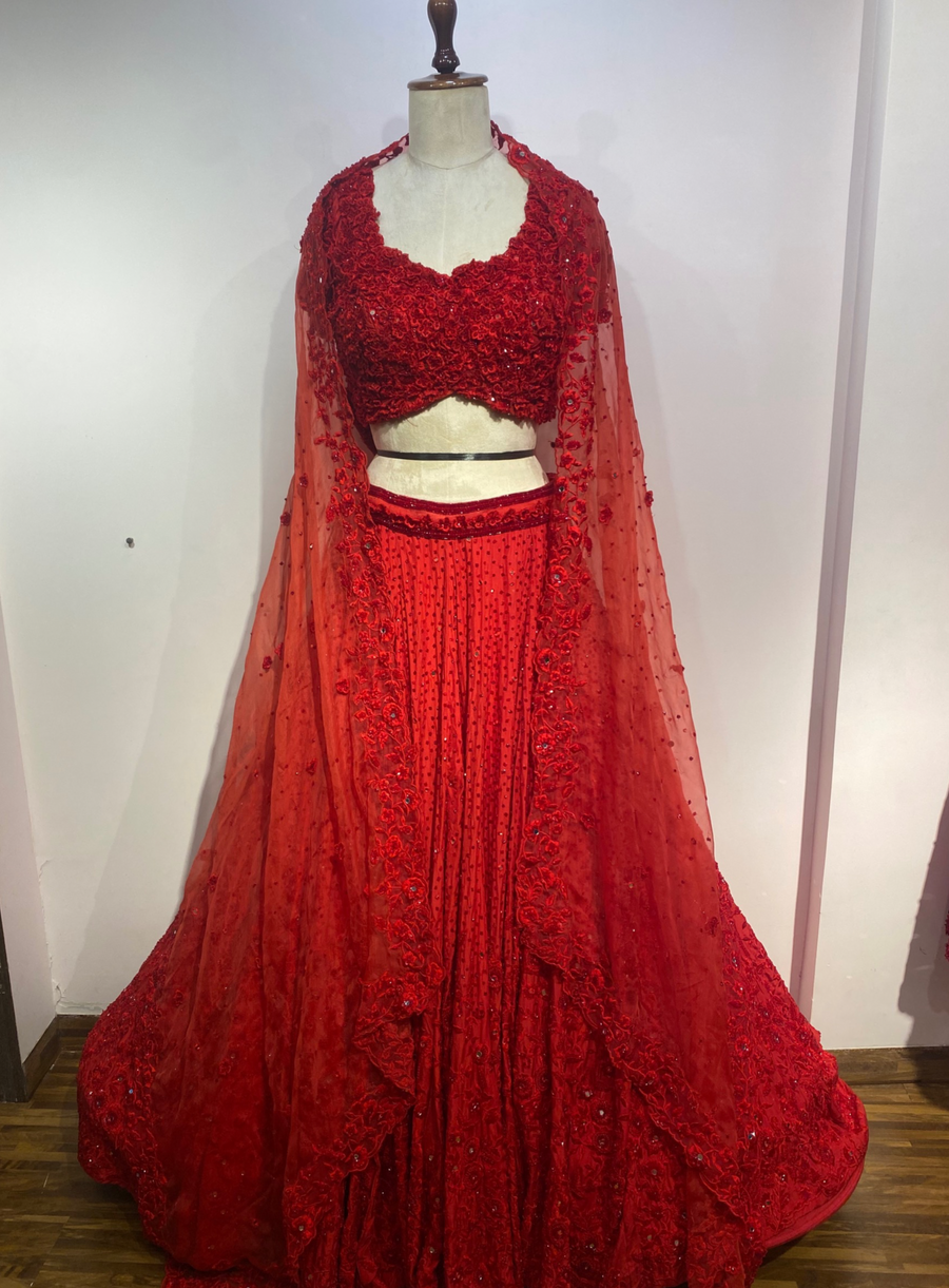 Tropical red 3D flower blouse and lehenga with embellished sheer dupatta, shown on a mannequin