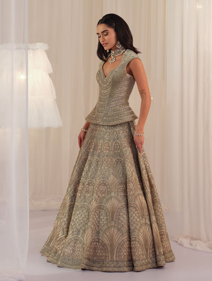 Side view of the ivory corset with zardosi fan-motif raw silk lehenga