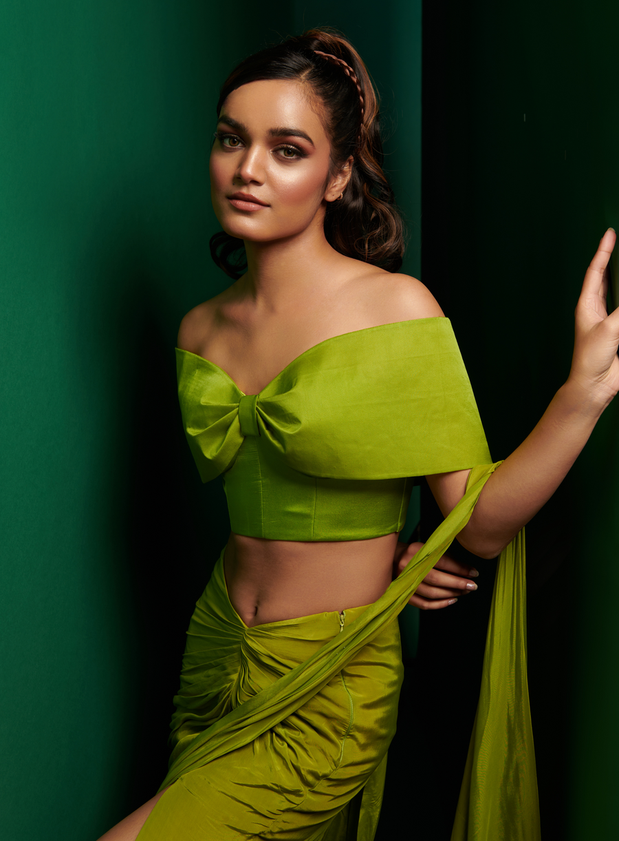 Lime green off-shoulder bow blouse with slit skirt drape saree, front view