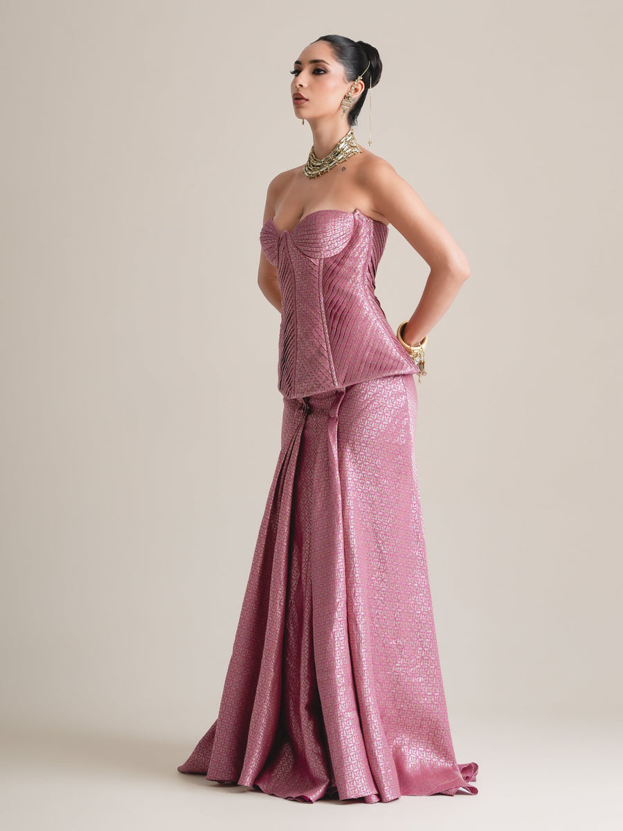 Rose-pink quilted sweetheart corset and floor-length fishcut skirt, full-length three-quarter view with hand on hip