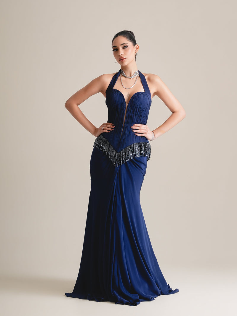 Navy halter plunge corset with V-shaped beaded fringe and flared drape skirt, full-length front view, hands on hips