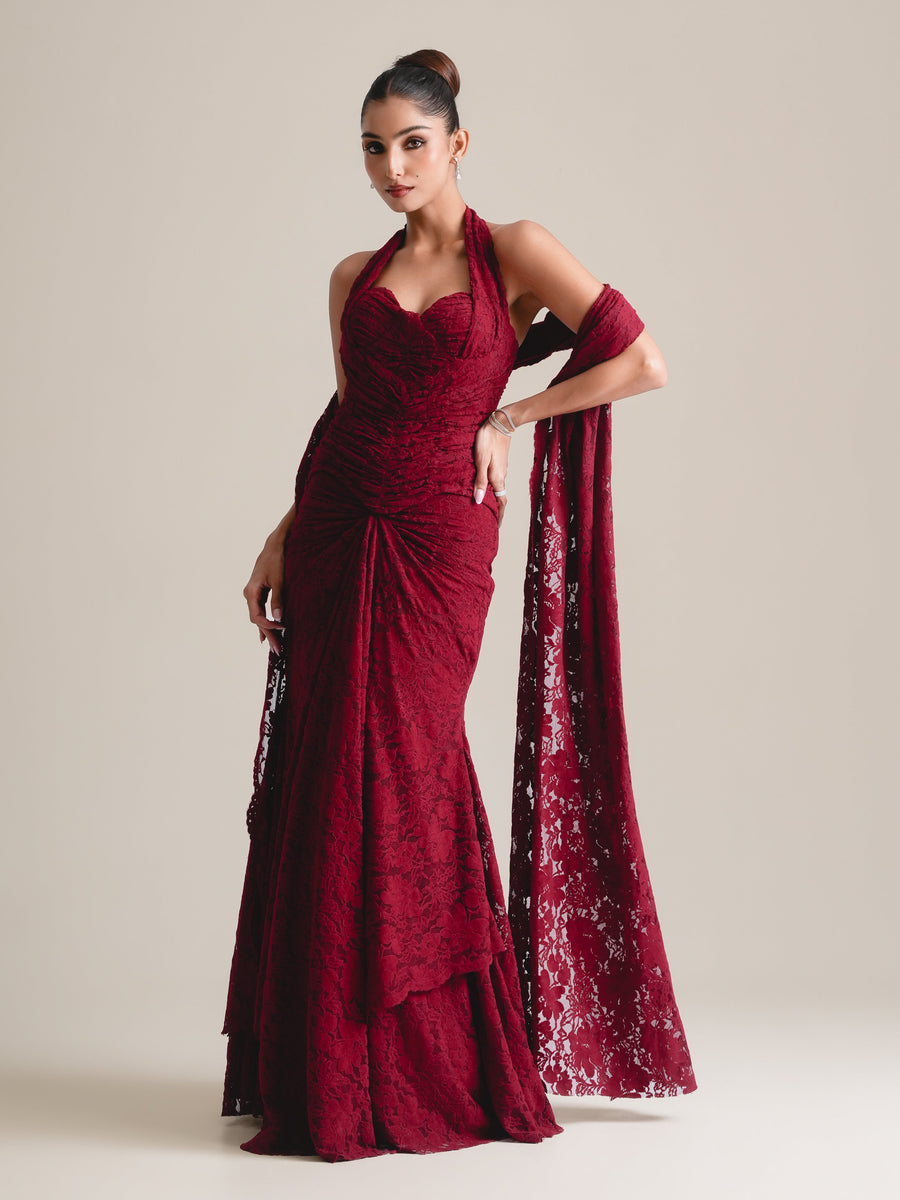 Maroon lace halter corset with ruched bodice, a long lace stole and a fishcut skirt, full-length view, hand on hip