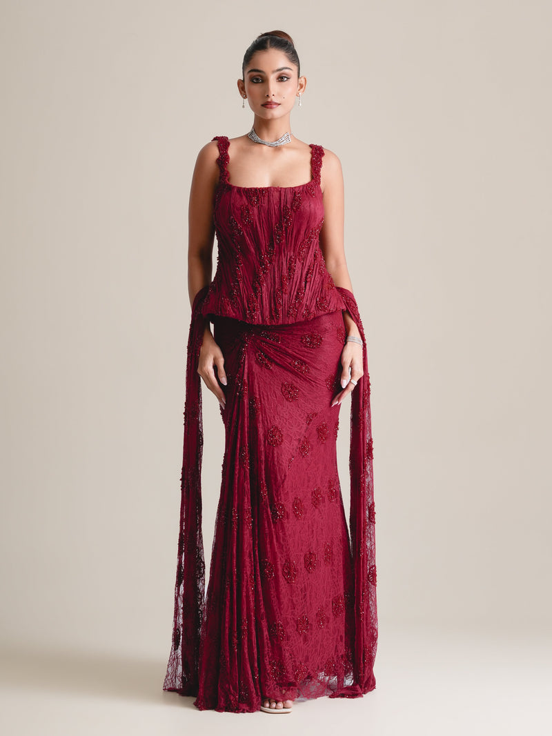 Maroon square-neck embroidered lace corset with a fishcut skirt and a lace drape falling from the hips, full-length front view