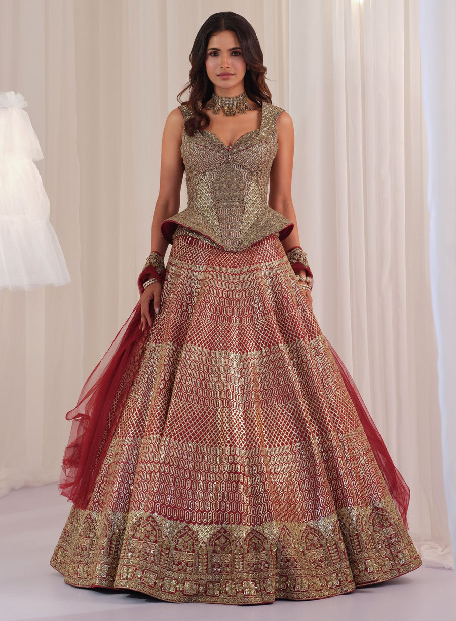 Maroon raw silk lehenga with peplum sculpt corset and sequin embroidery