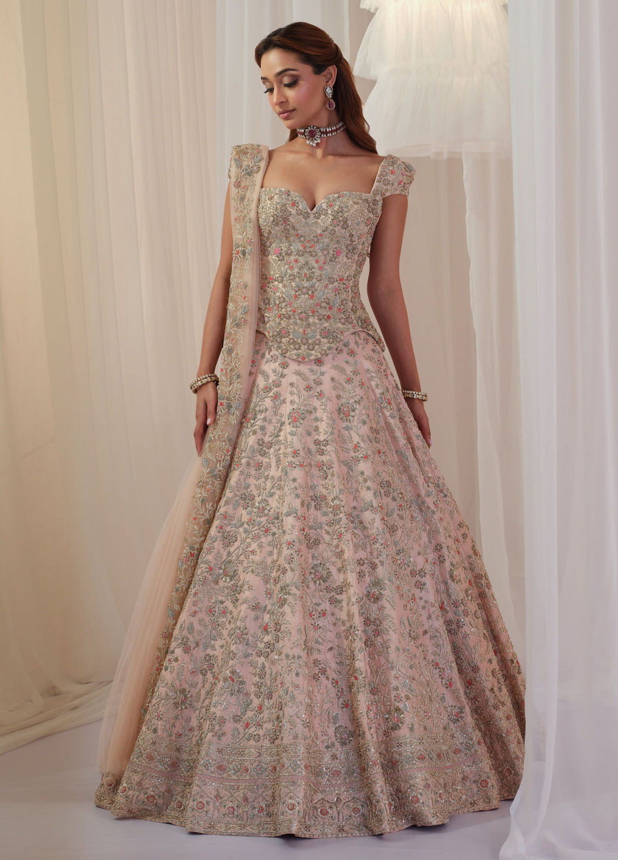 Blush pink bridal corset lehenga with floral zardozi embroidery and patra sequins