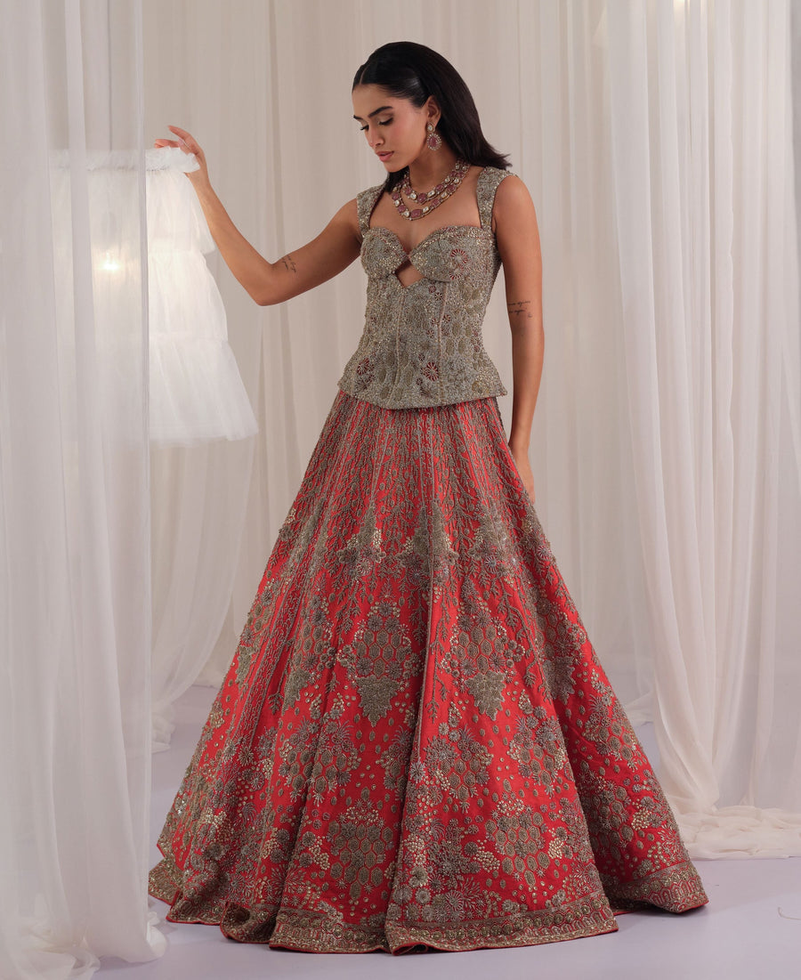 Red hand-embellished cutout corset with raw silk lehenga in floral jaal motifs