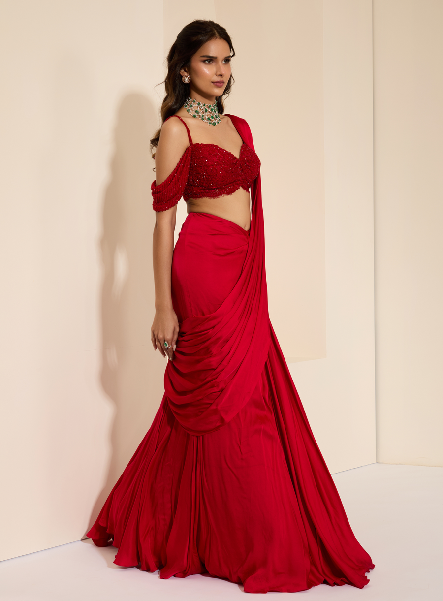 Full-length view of the red lace bustier with fishtail drape saree