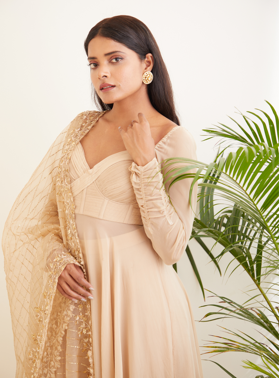 Beige Anarkali with ruched sweetheart bodice, full sleeves and embroidered dupatta, close-up