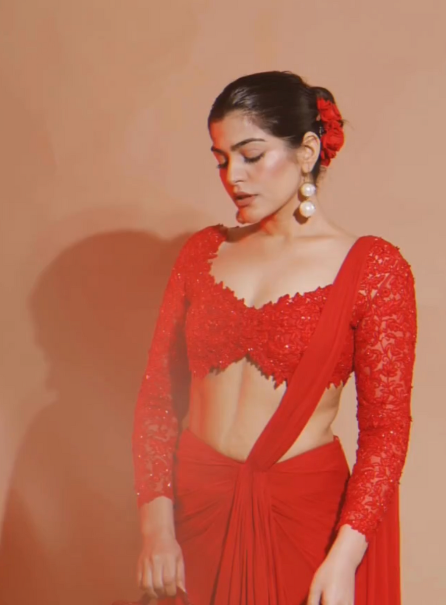Classic red drape saree with intricate draped silhouette