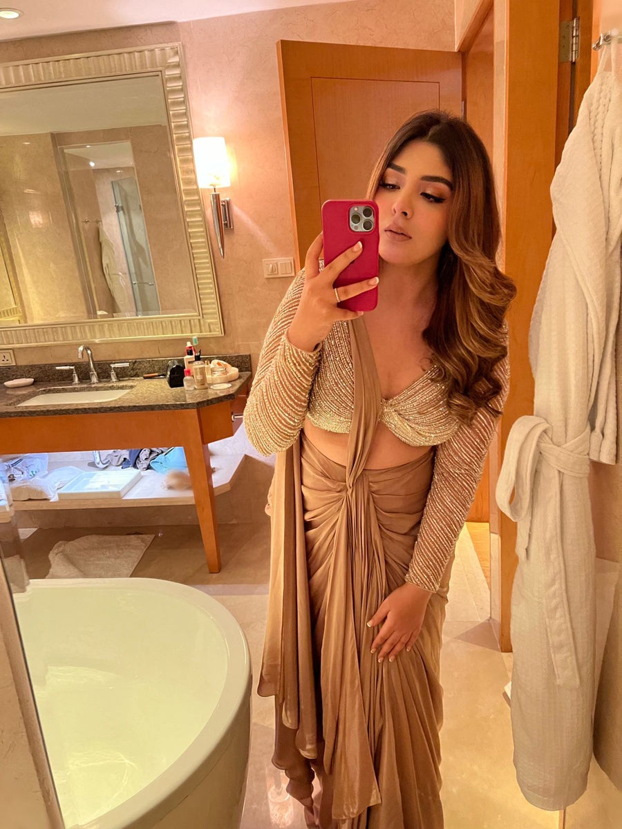 Silver hand-embellished twisted full sleeve blouse with nude drape saree, mirror selfie