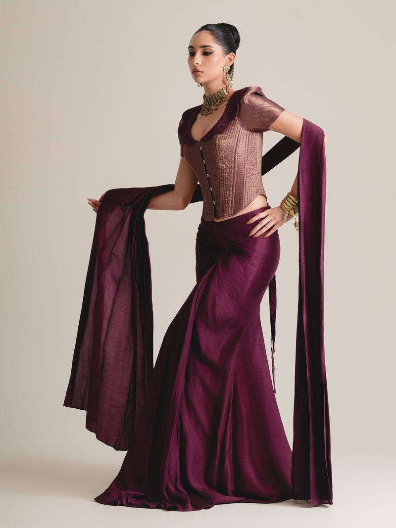 Plum metallic puff-sleeve corset with scalloped collar and a wine drape skirt, stole held out, full-length view