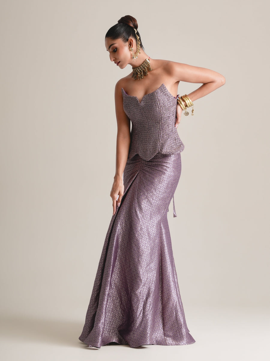 Lilac-grey scalloped corset and ruched fishcut skirt, full-length three-quarter view, head tilted down