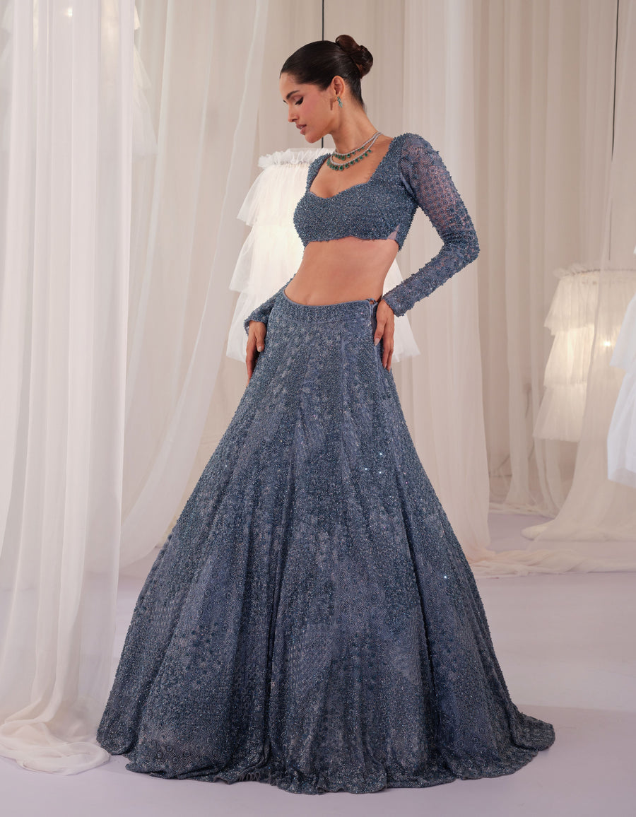 Full-length view of the metallic blue embellished blouse with crystal-worked lehenga