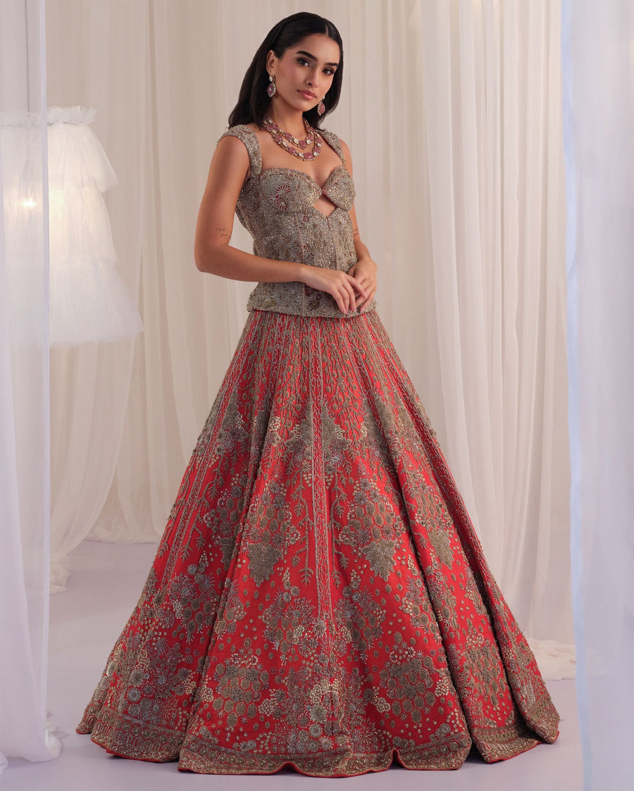 Red hand-embellished cutout corset with raw silk lehenga in floral jaal zardozi embroidery