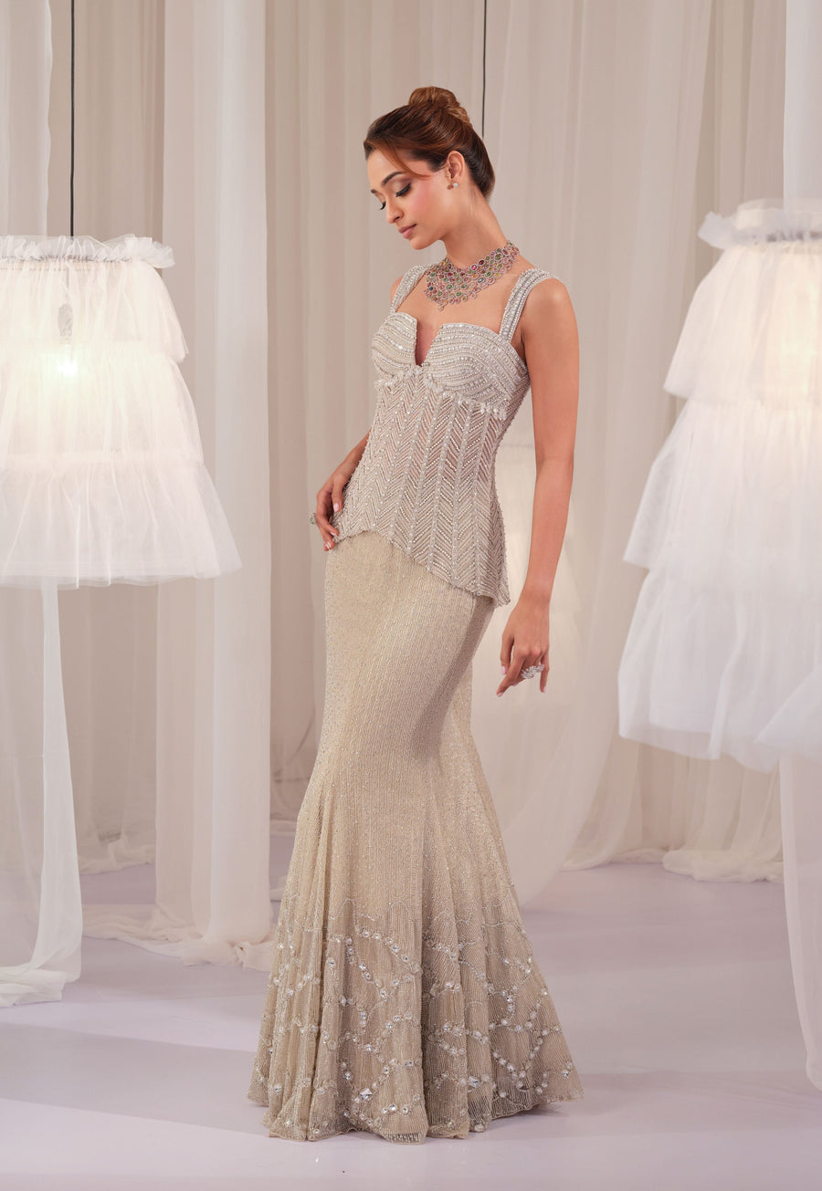 Side view of the silver corset with cutdana-embroidered fishcut lehenga